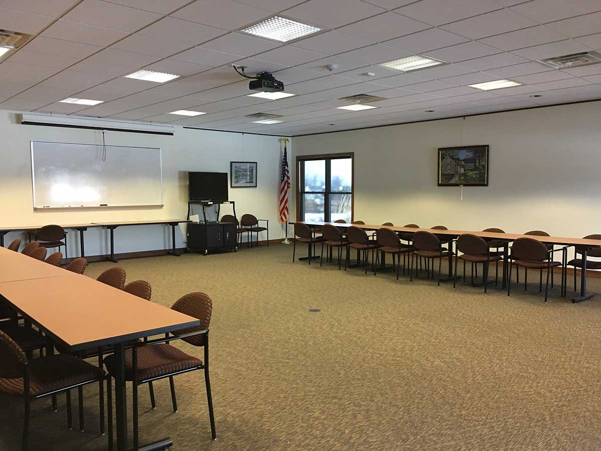 Interior shot of the Smithsburg Community Room with a lot of open space and available tables and chairs