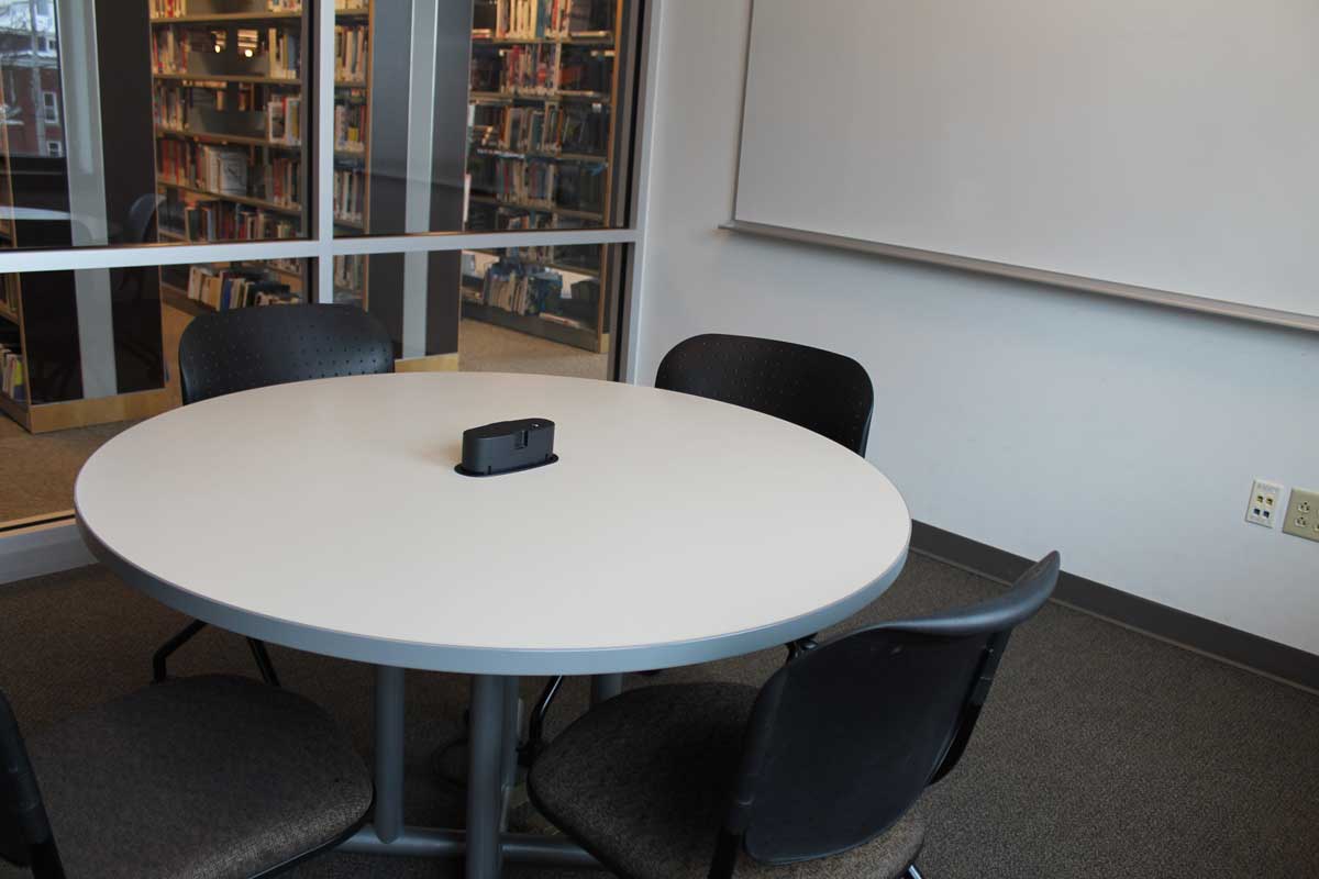 Interior shot of Study Room 1 showing circular table and whiteboard
