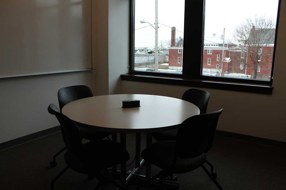 Interior shot of Study Room 2 - 332 showing circular table and white board