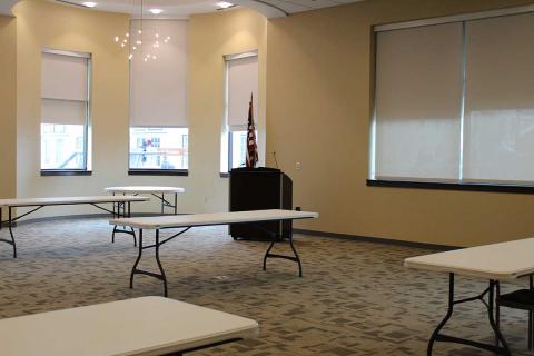 Interior shot of the Combined Community Room 308/309 with tables and whiteboard