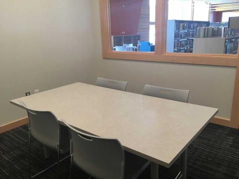 Interior shot of the Quiet Study Room at Hancock equipped with rectangular table and chairs