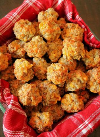 red checked napkin with sausage bites on it