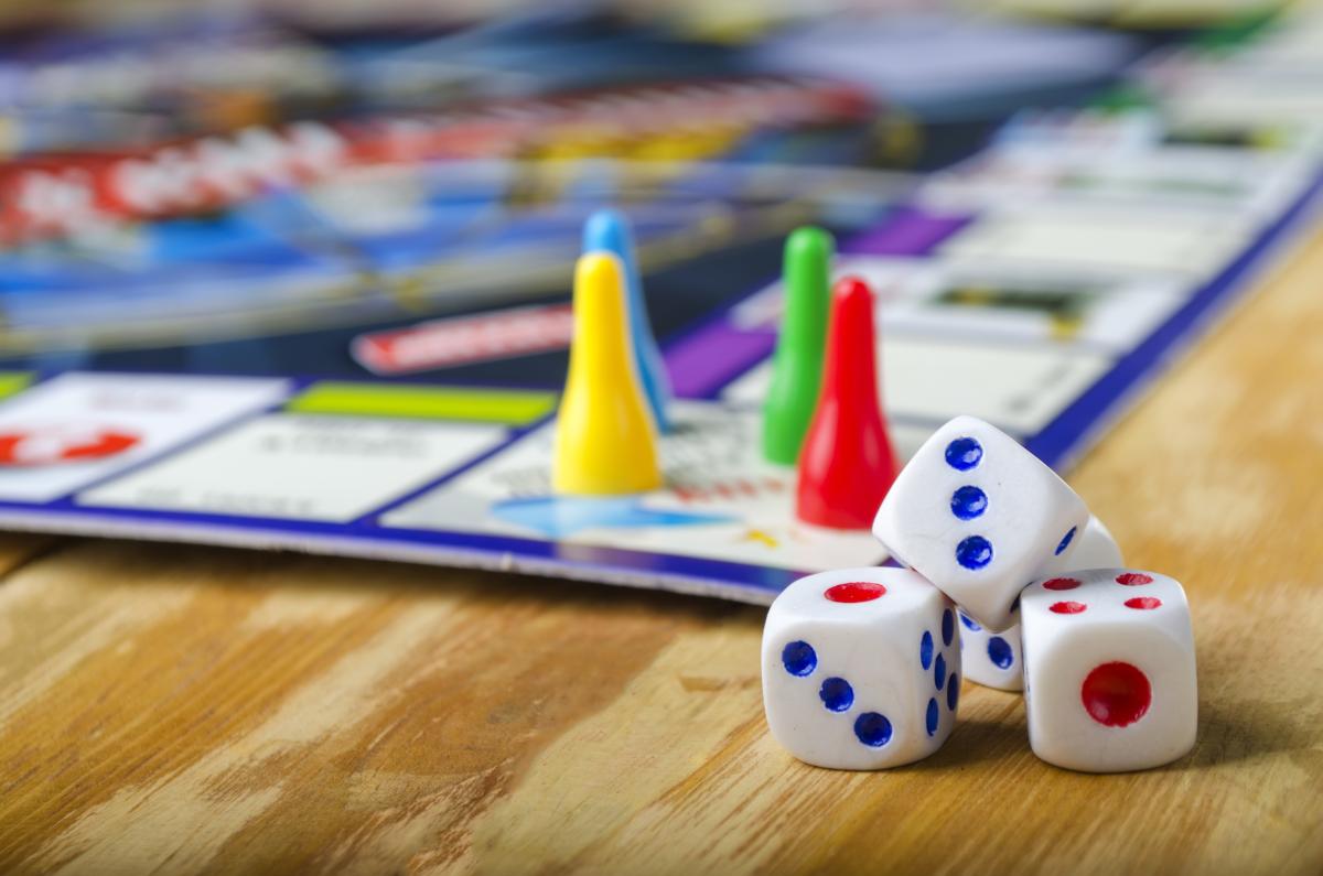 Game pieces and game board on table